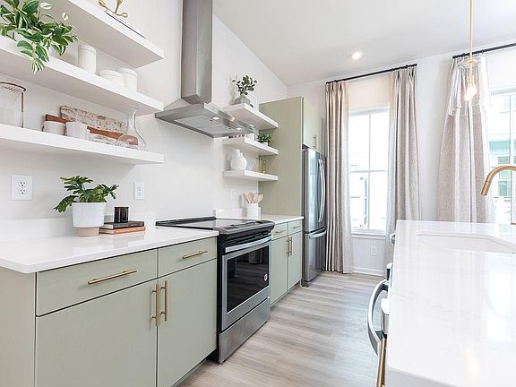 Representative photo - 2nd floor open concept kitchen, dining & living area with access to covered porch