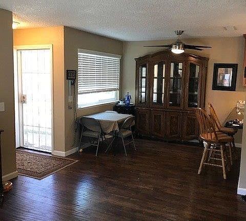 A view of the entry and dining area...notice the handsome fan!