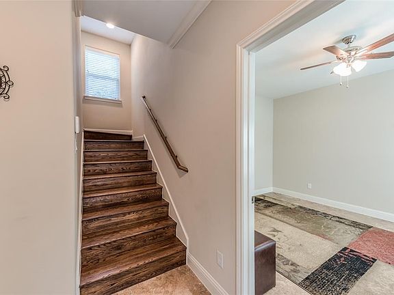 The spacious bedroom offers Travertine floors, , glass door to yard, private bath and nice walk-in closet.