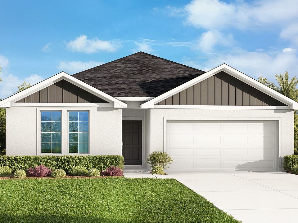 Elegant white facade, sharp gabled roof, and verdant landscaping in North Port.