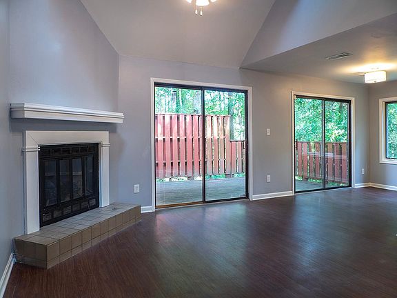 Living room, working fireplace and deck