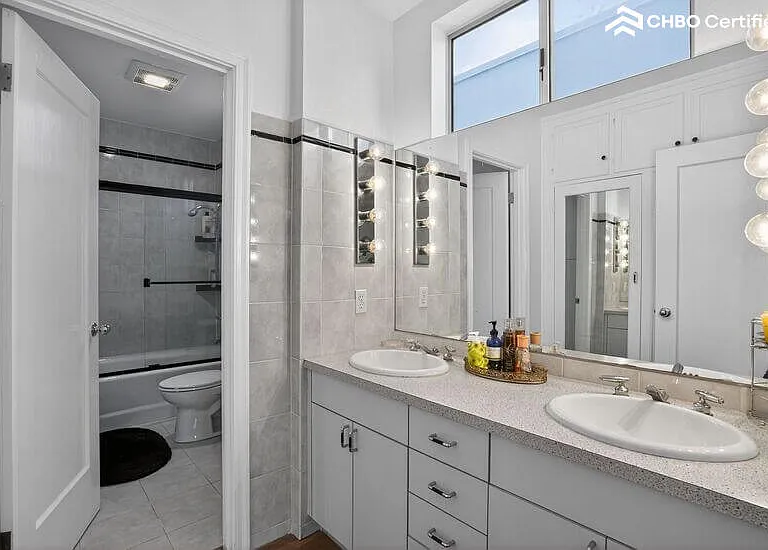 The main level guest bathroom is well-lit w/ natural light