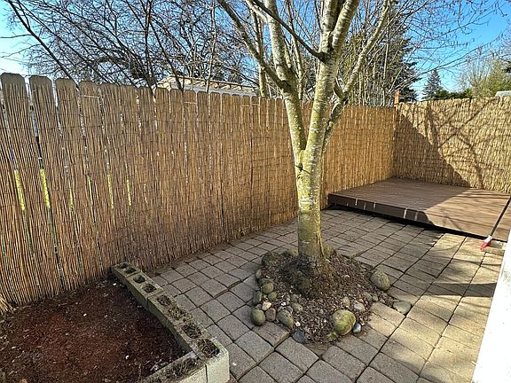 Private backyard space with composite deck and small planter space