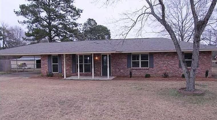 Front with two car carport on the side