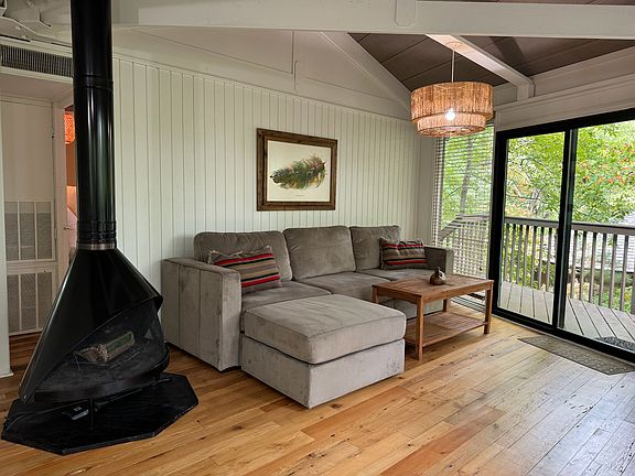 Living room with mid century modern wood burning fireplace