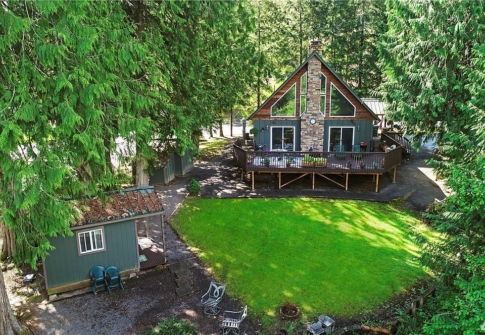 This wonderful oasis is on .49 acres and is one of only 2 parcels in the Mayfield Lake community that has a creek running through it...