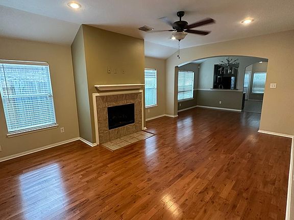 Living room with wood floors and cozy fireplace