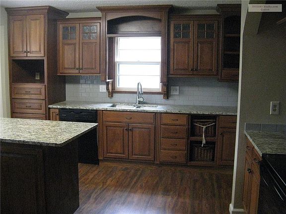 New granite counter tops, island, cabinets and flooring.