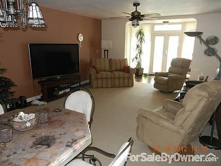 Living Area
						:
						Berber carpeting, knockdown-texture ceilings, new fixtures, sunroom