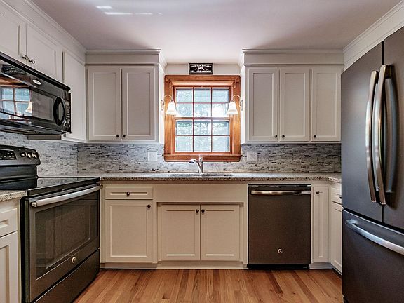 Kitchen is equipped with a dishwasher, garbage disposal and built in microwave