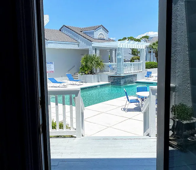 View of pool from back door in living room