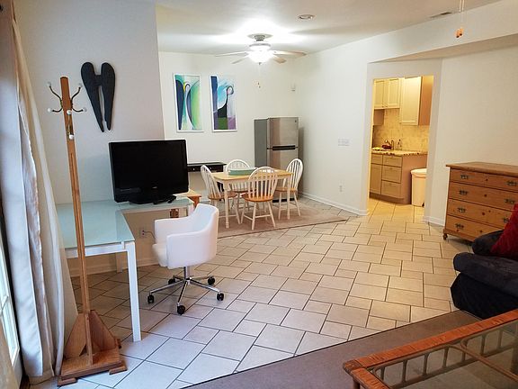 Office space with dining area and view into kitchen