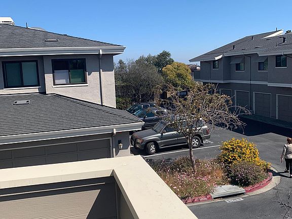 View facing east toward the Bay, entry landing/balcony