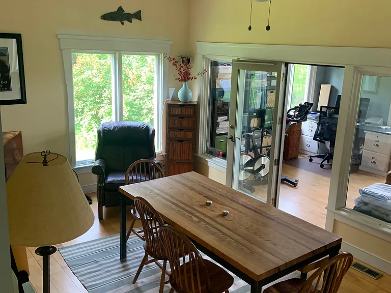The dining room moves into the office/TV room