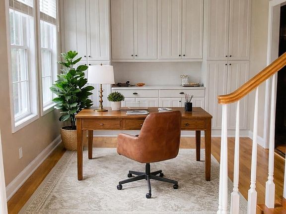 Home Office with built in cabinets and quartz countertop
