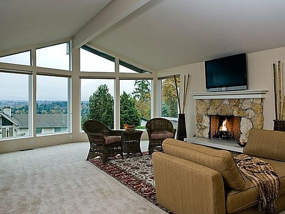 Imagine coming home to this lovely living room, with view of Cascades & warm, cozy gas fireplace.