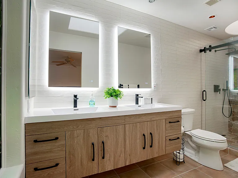 Primary Ensuite - Double-Sink Vanity, Comfort Height Toilet, Towel Warmer, Barndoor Shower Doors for ease of use