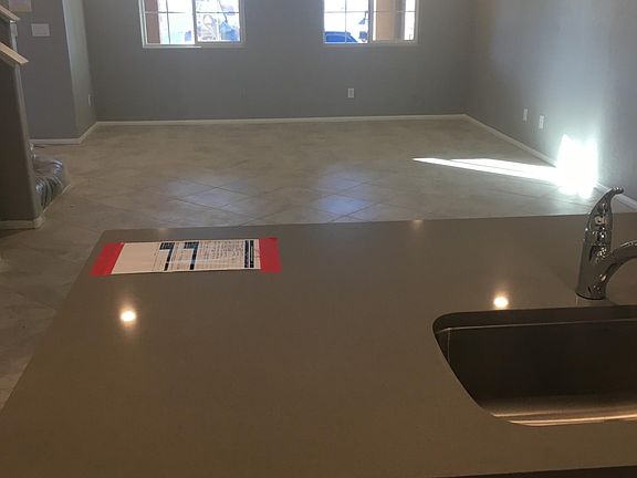 Kitchen looking into the great room. Dining room light fixture and ceiling fan to still be installed.