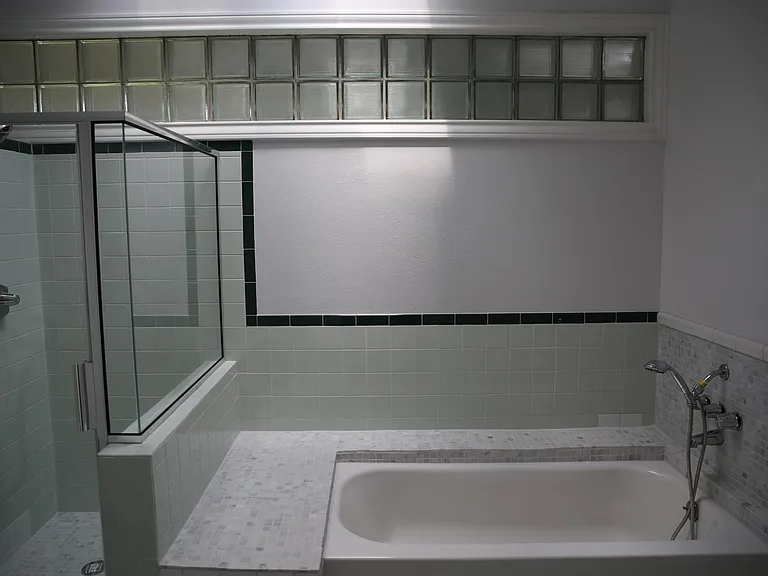 Master bath with tub bench and shower