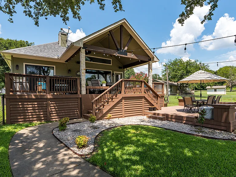 Covered porch with plenty of seating.
