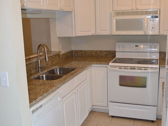 View of kitchen from foyer. Notice BRAND NEW GRANITE!