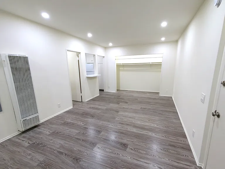 living room entrance over looking the entrance to the bathroom