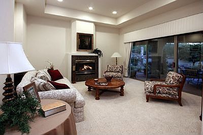 Formal living room with cozy fireplace.