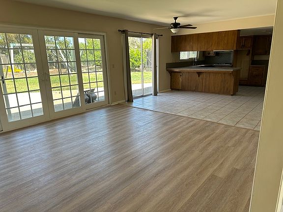 Family room and kitchen in the back. View of backyard