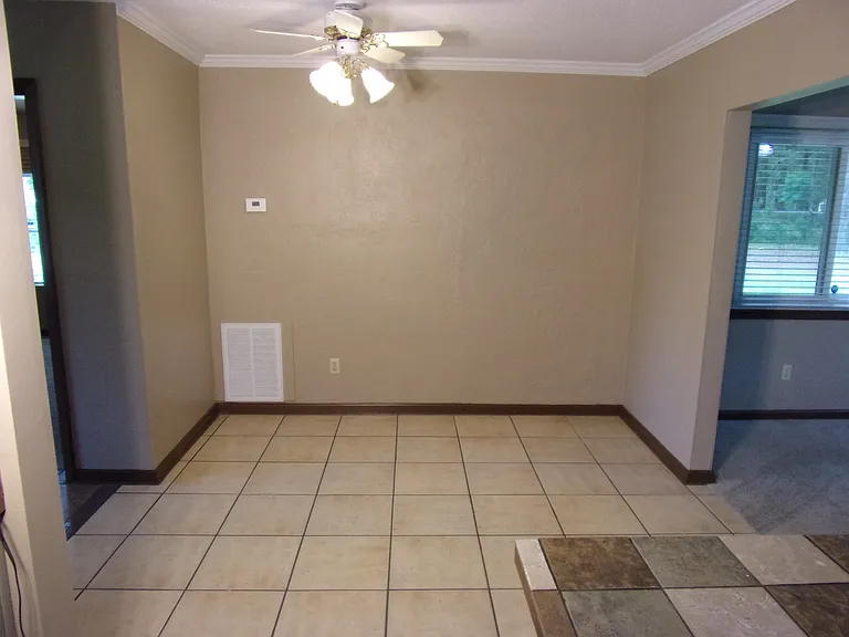 DINING AREA ADJACENT TO KITCHEN, SUNROOM, AND LIVING ROOM
