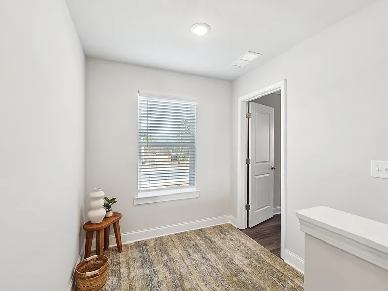 Spacious upstairs loft offering seamless access to the bedrooms.