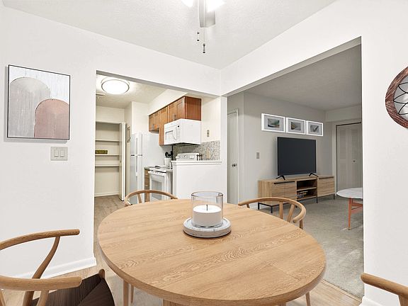Open Concept Kitchen, Dining, and Living Room (Shown here in a 2-bedroom floor plan with model furniture)