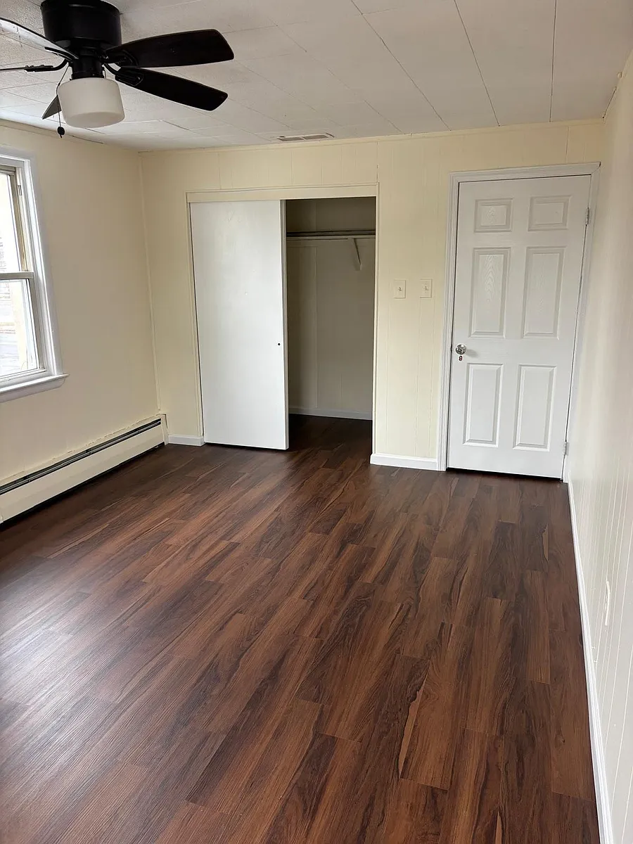 Bedroom #1 with new floor and plenty of sunlight7 Large Closet - 1607 S Olden Ave #B
