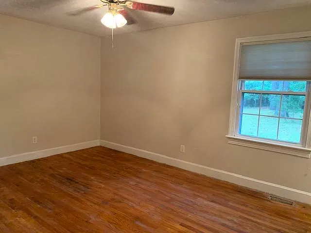 Large bedroom. Ceiling fan. Spacious closet. Attached half bath. New blinds.