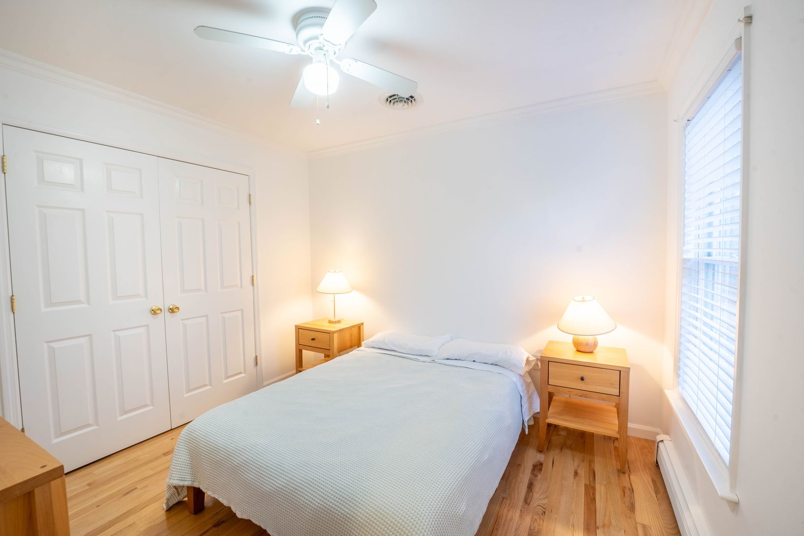  bedroom 3 with dresser and large closet, full size bed, and front yard view