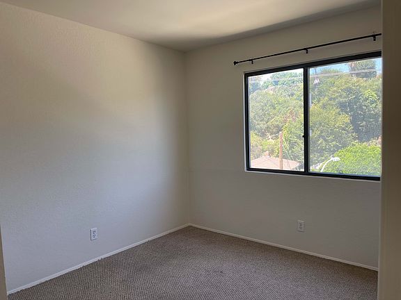 2nd bedroom facing window & wall