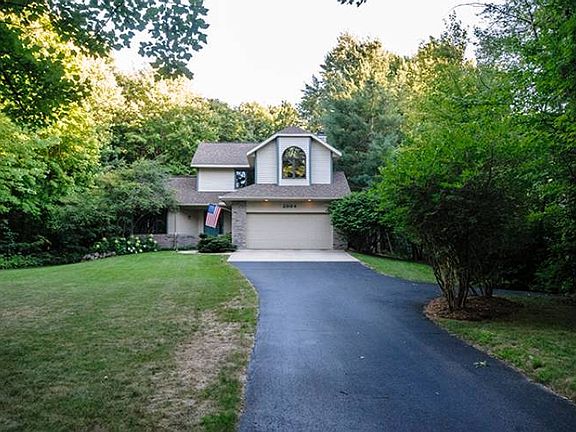 Located conveniently in the Dow High, Jefferson Middle and Siebert Elementary School Districts, this home was built in 1994 and sits on a sprawling .85 acre lot with tastefully manicured landscaping designs throughout. The roof was replaced in 2013, the septic tank was pumped this summer, and the long asphalt driveway offers additional parking making this home move in ready!