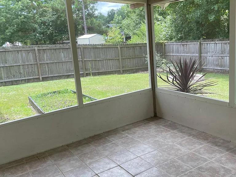 The private backyard is fully fenced and has areas where a vegetable or flower garden can be established. Pull up hour chairs to a fire pit. A big container of firewood will be ready for you. Yard is home to delightful Mockingbirds, set back and enjoy