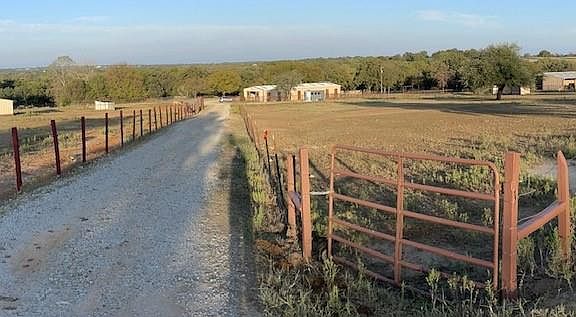 View of 2 horse barns