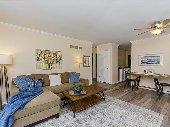 Great room offers upgraded waterproof vinyl plank flooring and expandable dining area