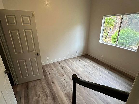 Downstairs bedroom or office with large walk-in closet.