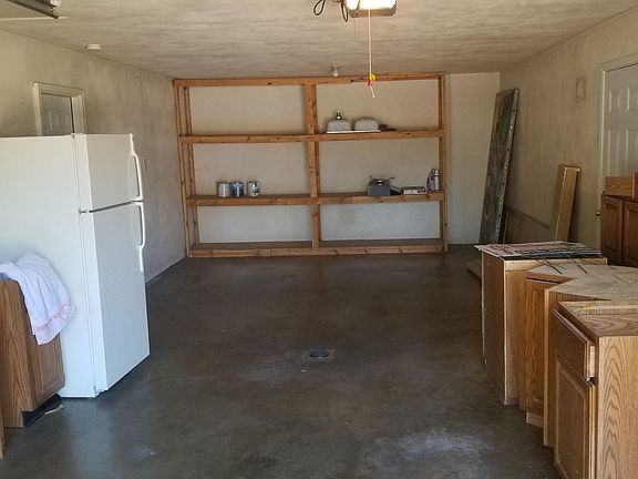 Oversized One Car Attached Garage with shelving