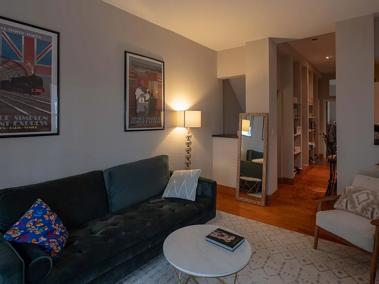 Living room with french doors opening out on to private garden