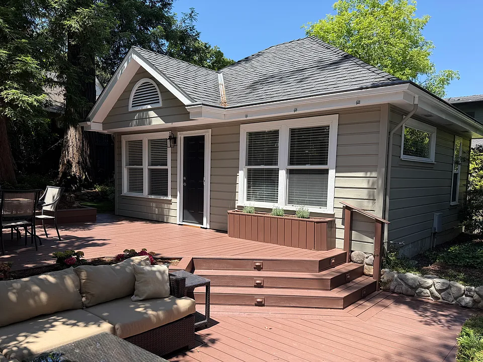 Deck & front of cottage, couch & shaded table