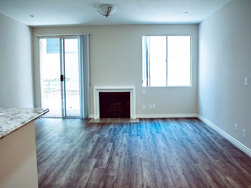 Living Room w/ patio door leading to balcony