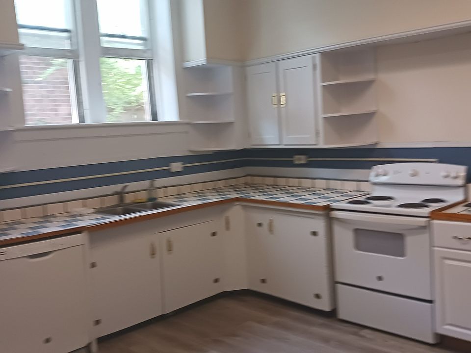 KITCHEN WITH SINK, AND WASHER, AND STOVE
