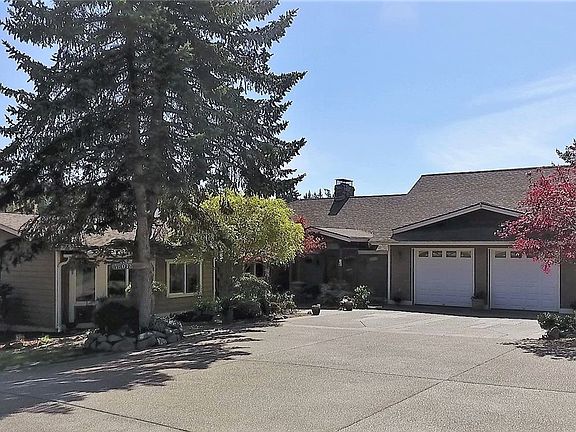 Front of home with 2 car attached garage