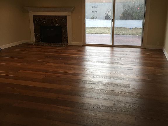 Your living room with beautiful hardwood, end-to-end. A trul