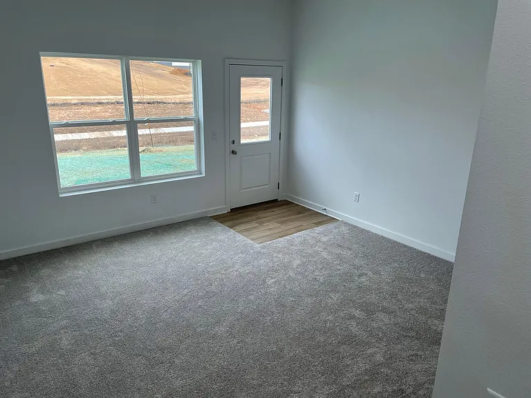 Lower level family room with door to patio area.