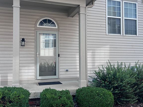front door (packages left on this porch entry)