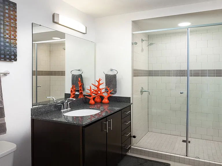 Modern style bathrooms with large glass-door showers